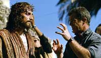 Mel Gibson (right) directs Jim Cavizel as Jesus in <i>The Passion of Christ</i>. Image