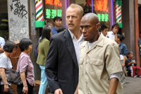 Bruce Willis is a cop and Mos Def his prisoner in <i>16 Blocks</i>. Image