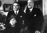 Joan Fontaine (bottom) and Laurence Olivier (left) star in <i>Rebecca</i>. Image