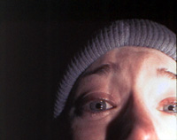 Heather Donahue is terrorized in the forest in the low-budget blockbuster, <i>The Blair Witch Project</i>. Image