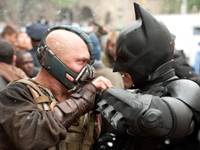 Batman (Christian Bale) and Bane (Tom Hardy) battle in 'The Dark Knight Rises'